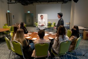 Business meetings the audience asks a question or offers an idea to the speaker during brainstorming session